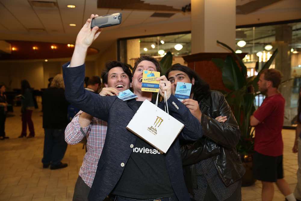 Three boys with KC Film Fest Passes Clicking a Selfie