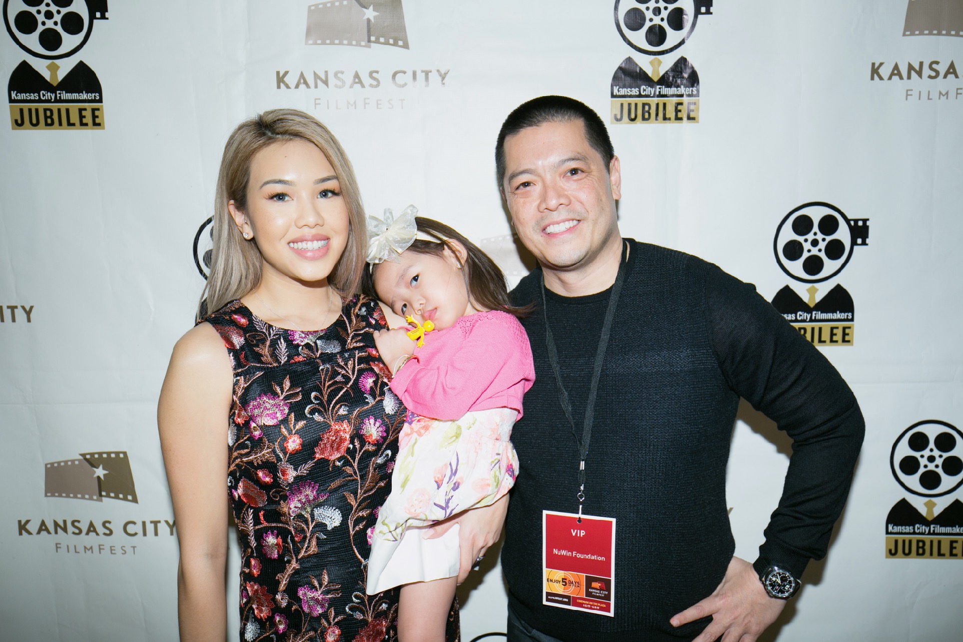 A couple with a cute baby girl at KC Film Fest