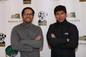 two men wearing jackets at the KC Film Fest