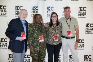 Two men and women with the KC Film Fest Passes