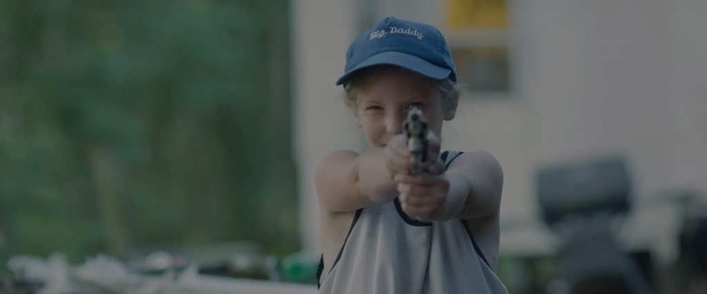 A Little Girl Holding a Hand Gun